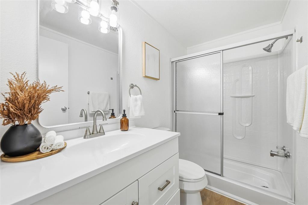 960 Pecan Street Azle, TX 76020 - Photo 25 of 34 a bathroom with a sink a toilet and shower