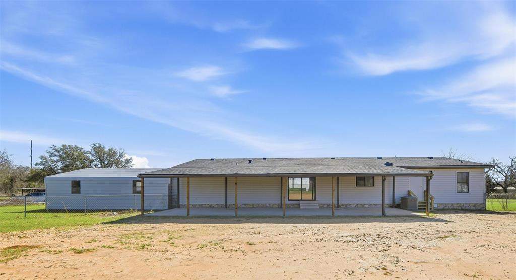 960 Pecan Street Azle, TX 76020 - Photo 28 of 34 a front view of a house with a yard