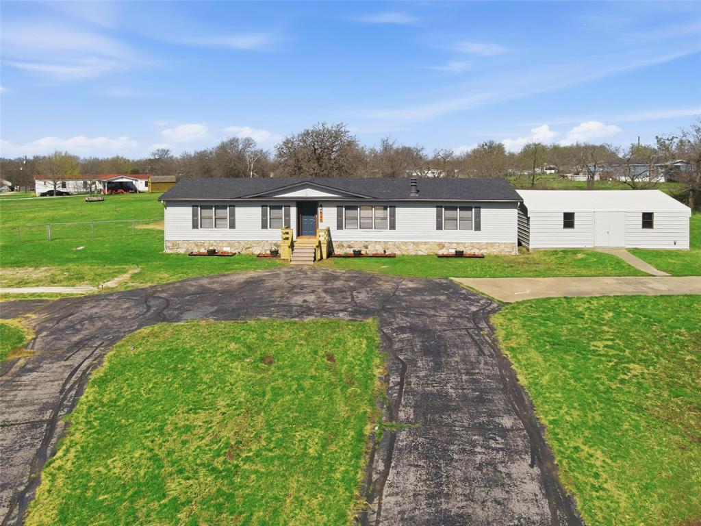 960 Pecan Street Azle, TX 76020 - Photo 30 of 34 a front view of a house with a yard