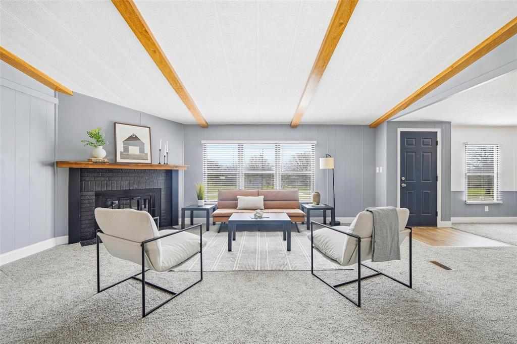 960 Pecan Street Azle, TX 76020 - Photo 5 of 34 a living room with furniture and a fireplace