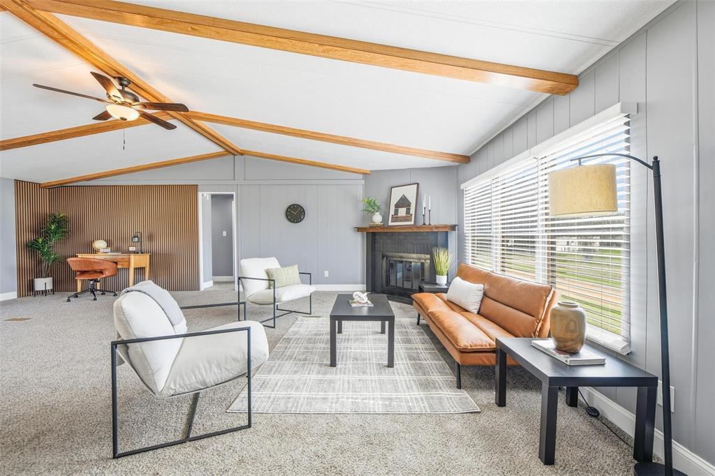 960 Pecan Street Azle, TX 76020 - Photo 7 of 34 a living room with furniture a fireplace and a table