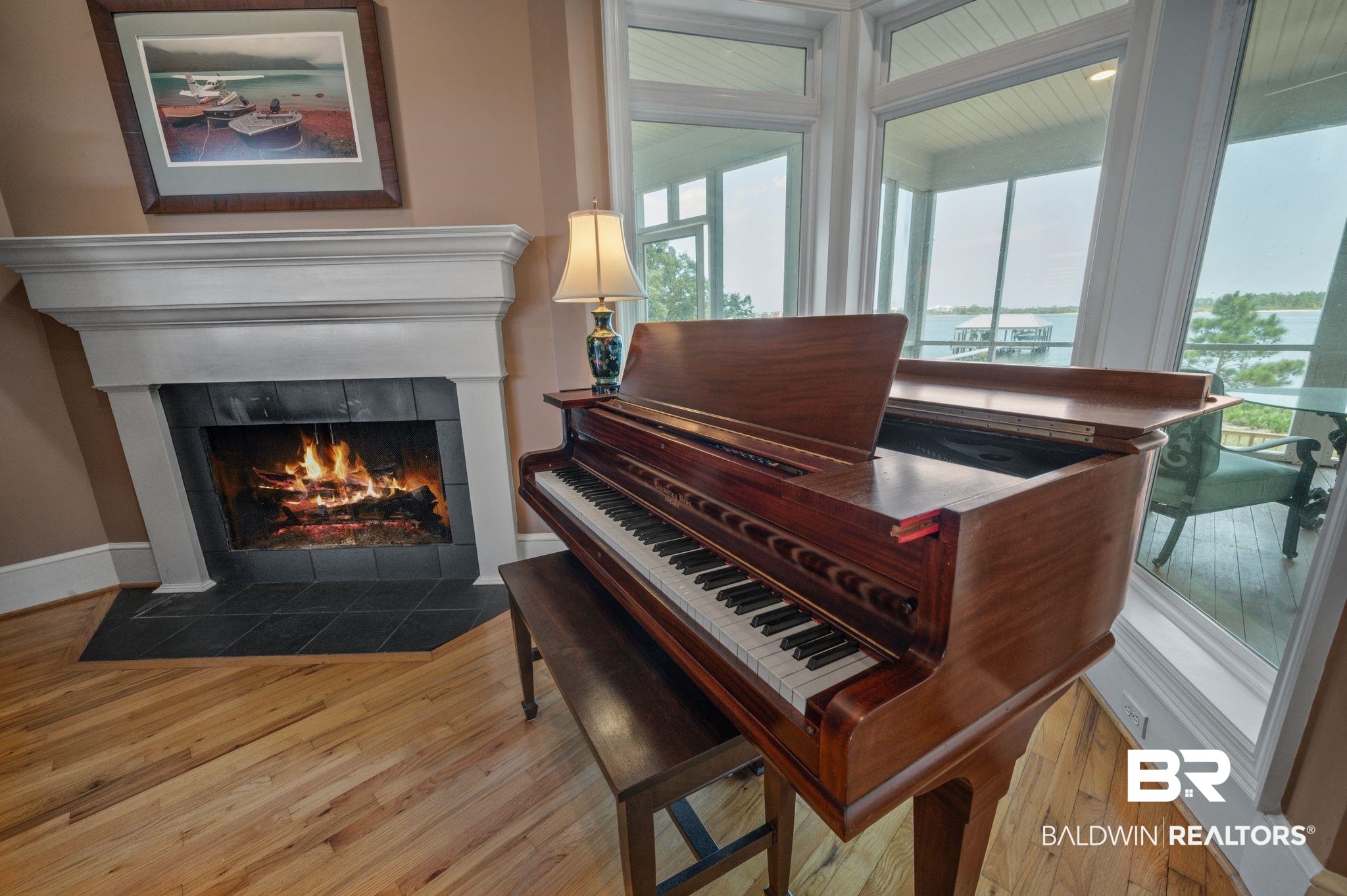 31800 River Road Orange Beach, AL 36561 - Photo 15 of 69 Miscellaneous room featuring plenty of natural light, light hardwood / wood-style floors, and a tiled fireplace