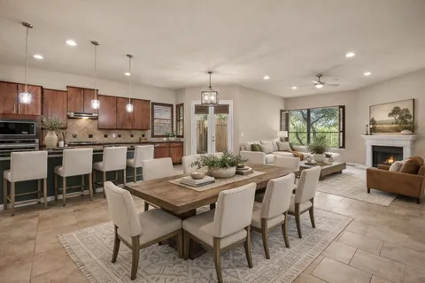 a kitchen with stainless steel appliances granite countertop a refrigerator and a stove top oven