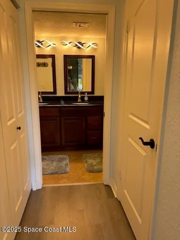 a view of a bathroom from a hallway