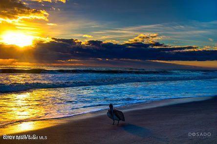 1830 North Atlantic Avenue, Unit C102 Cocoa Beach, FL 32931 - Photo 19 of 21 a view of an ocean from a house