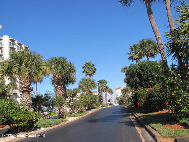 1830 North Atlantic Avenue, Unit C102 Cocoa Beach, FL 32931 - Photo 2 of 21 a view of a street with flower garden