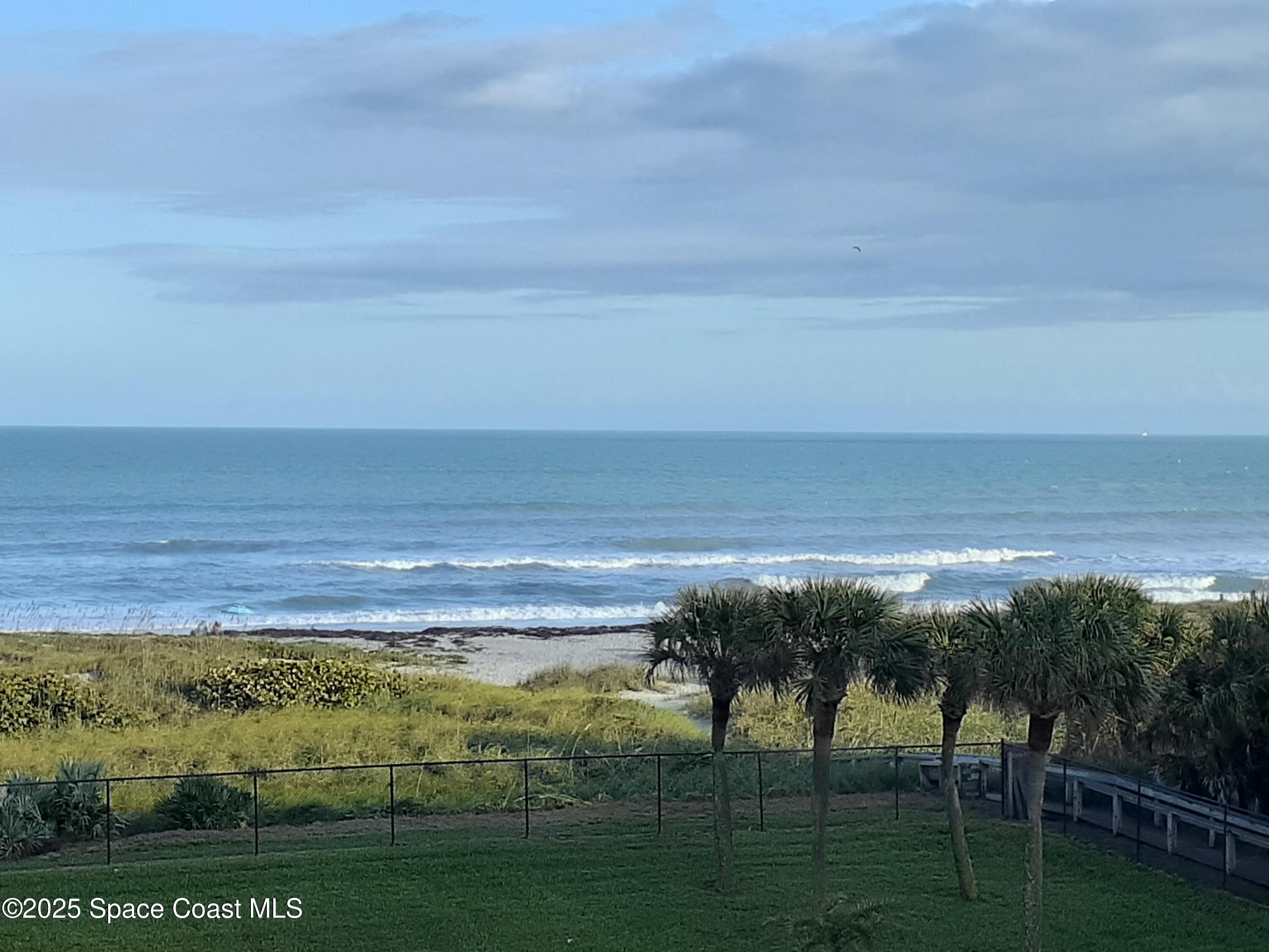 1830 North Atlantic Avenue, Unit C102 Cocoa Beach, FL 32931 - Photo 3 of 21 a view of an ocean from a balcony