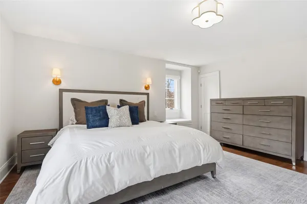 a bedroom with a bed and furniture