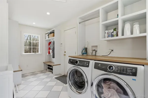 a view of storage and utility room with washer and dryer