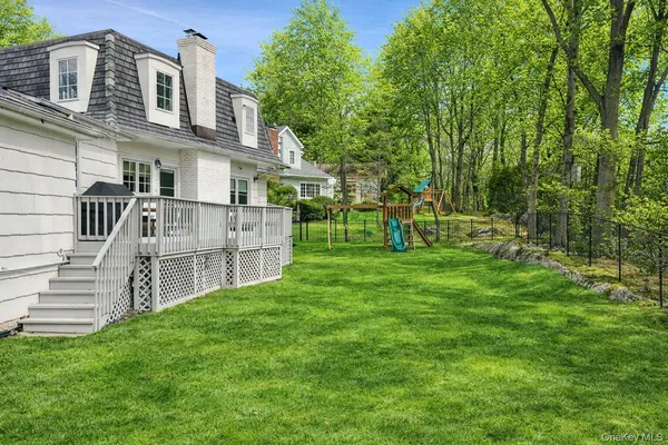 a view of a house with a sink and a yard