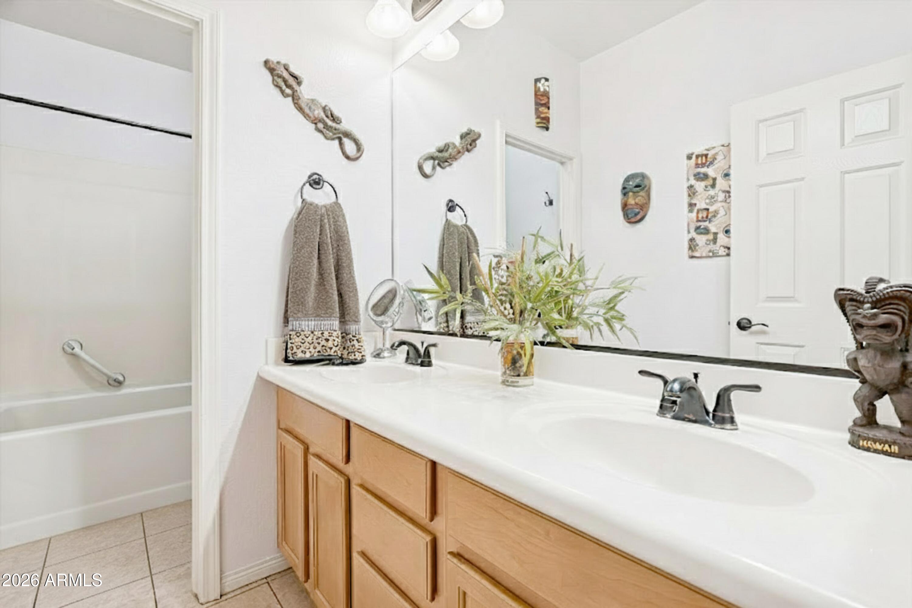 16632 South 175th Drive Goodyear, AZ 85338 - Photo 11 of 22 a bathroom with a sink and a mirror
