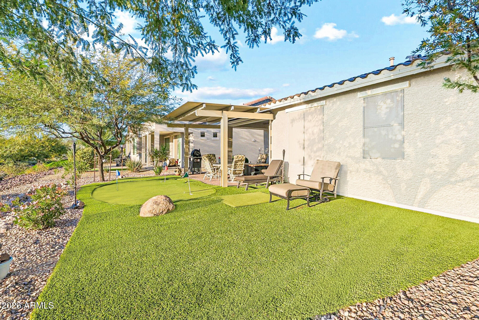 16632 South 175th Drive Goodyear, AZ 85338 - Photo 15 of 22 a view of swimming pool with outdoor seating and garden