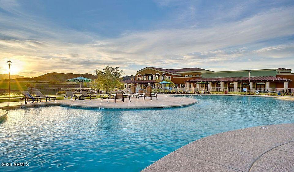 16632 South 175th Drive Goodyear, AZ 85338 - Photo 18 of 22 a view of a lake with a mountain in the background