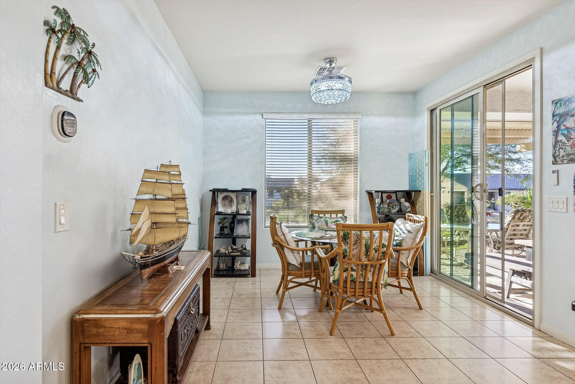 16632 South 175th Drive Goodyear, AZ 85338 - Photo 6 of 22 a view of a dining room with furniture and a window