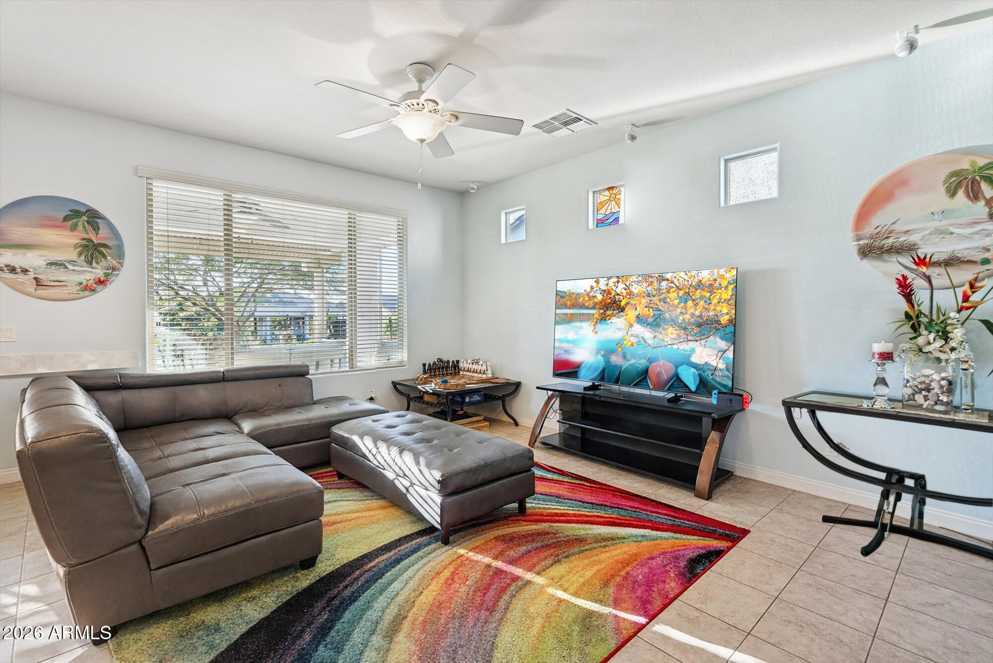 16632 South 175th Drive Goodyear, AZ 85338 - Photo 7 of 22 a living room with furniture and a flat screen tv
