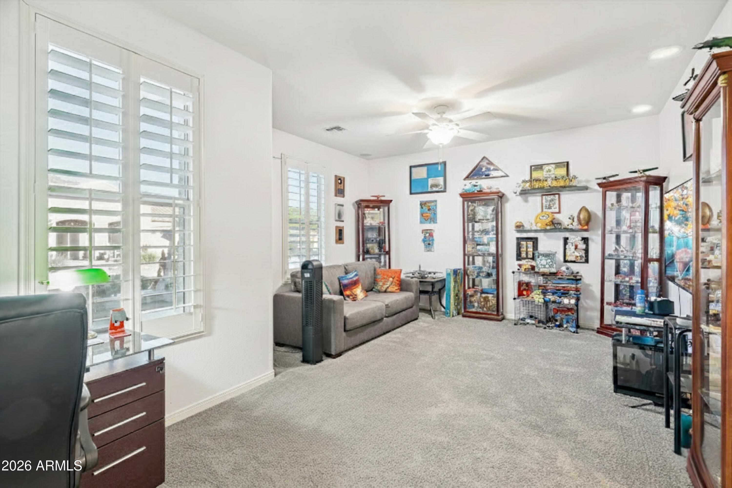 16632 South 175th Drive Goodyear, AZ 85338 - Photo 10 of 22 a living room with furniture and a large window