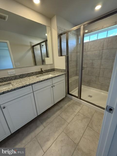 7608 River Reach Road Baltimore, MD 21244 - Photo 11 of 14 a bathroom with a double vanity sink and mirror