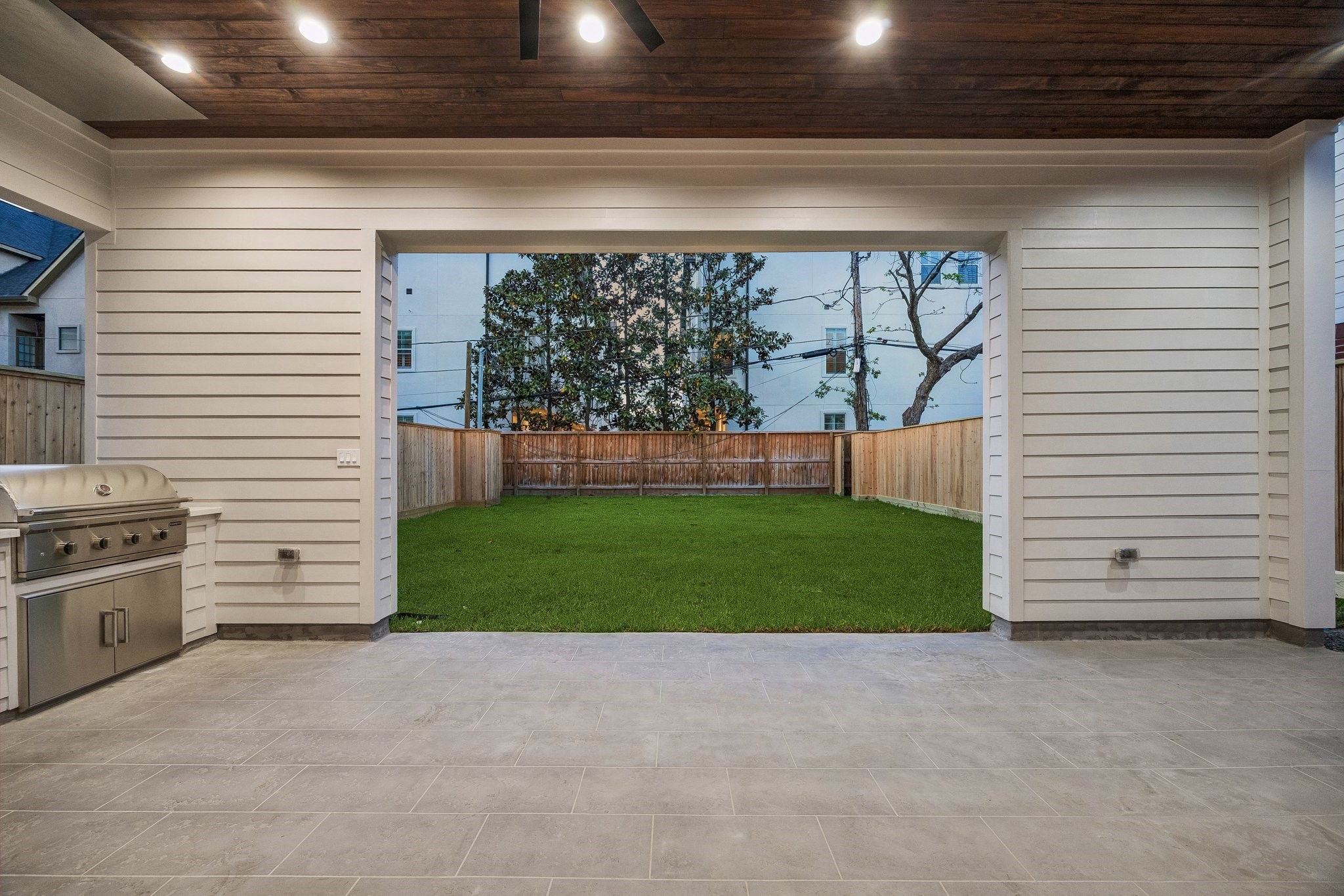 4034 Lanark Lane Houston, TX 77025 - Photo 31 of 32 Another view of the Covered Lanai looking out onto the yard.