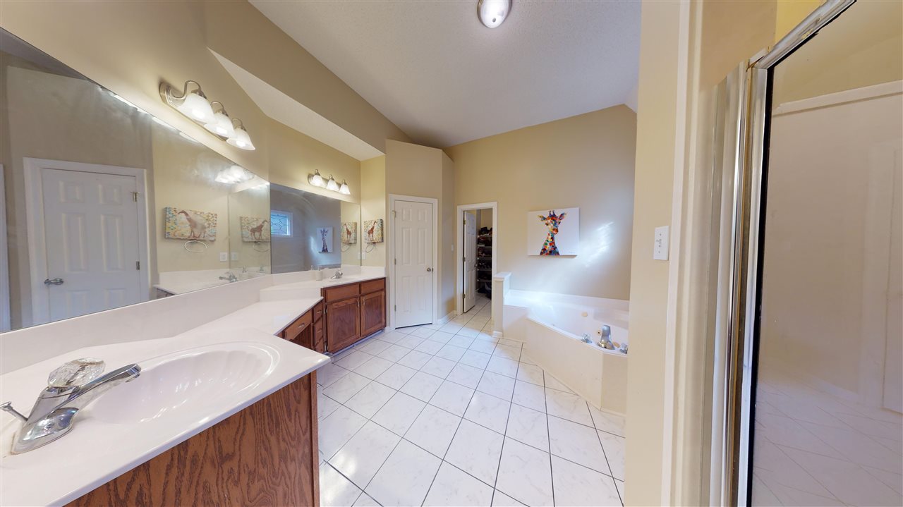 719 Gable Lane Collierville, TN 38017 - Photo 15 of 25 a bathroom with a sink a toilet and mirror