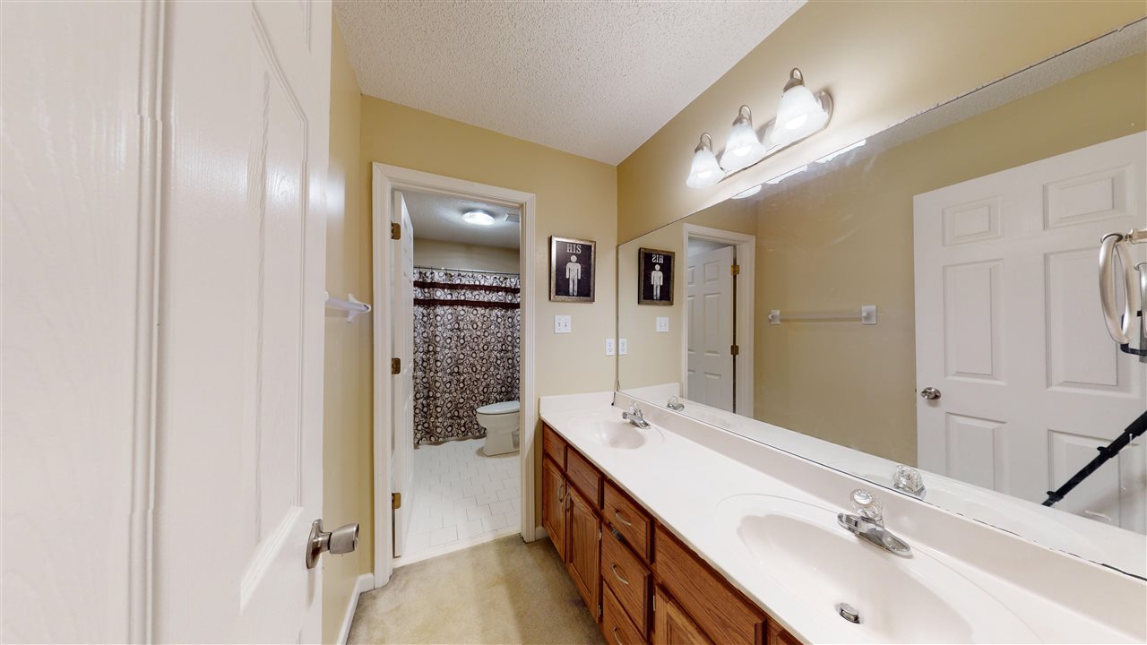 719 Gable Lane Collierville, TN 38017 - Photo 17 of 25 a spacious bathroom with a double vanity sink a mirror and a shower