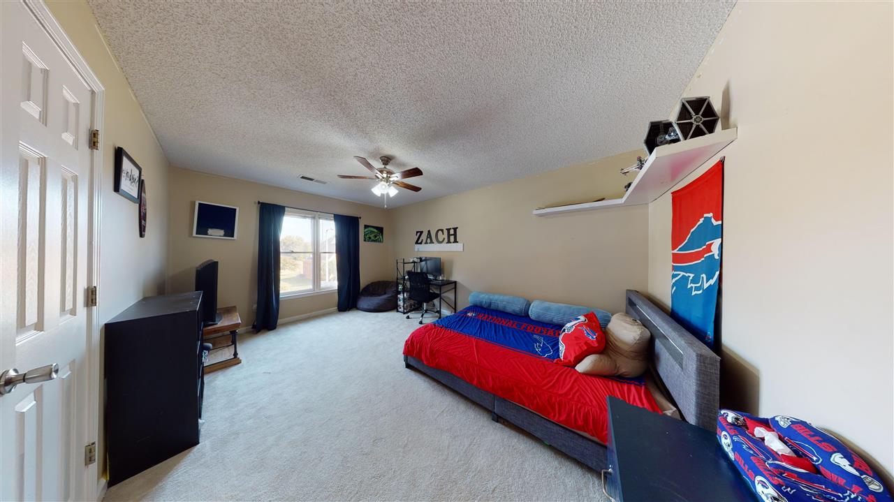719 Gable Lane Collierville, TN 38017 - Photo 18 of 25 a living room with furniture and a flat screen tv