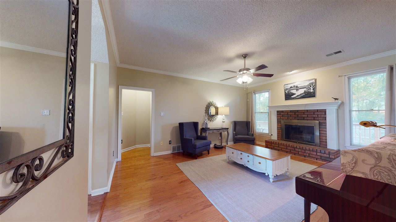 719 Gable Lane Collierville, TN 38017 - Photo 3 of 25 a living room with furniture and a fireplace