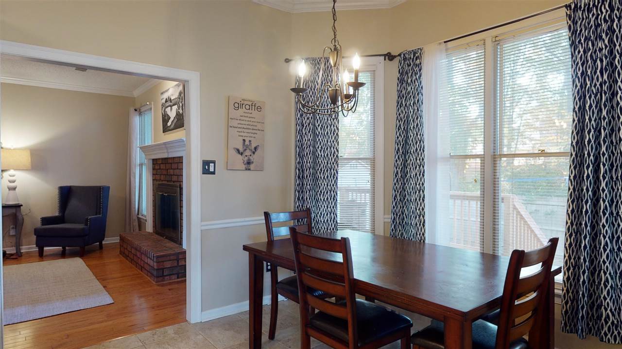 719 Gable Lane Collierville, TN 38017 - Photo 8 of 25 a view of a dining room with furniture window and wooden floor