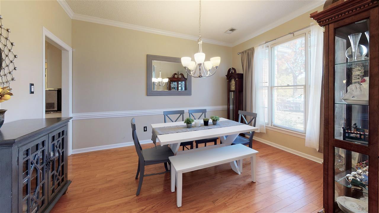 719 Gable Lane Collierville, TN 38017 - Photo 9 of 25 a living room with furniture a window and a flat screen tv