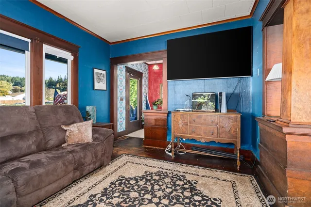 a living room with furniture and a flat screen tv