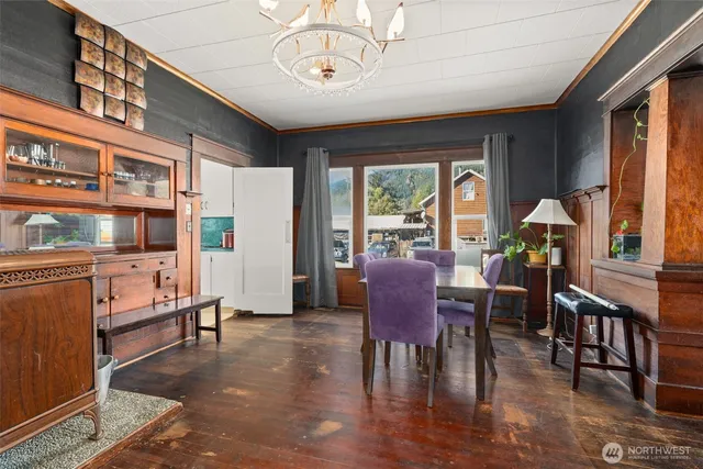 a view of a dining room with furniture window and wooden floor