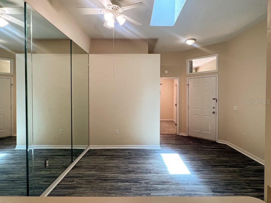 3911 Southwest 27th Street, Unit 9 Gainesville, FL 32608 - Photo 11 of 16 a view of a hallway with wooden floor