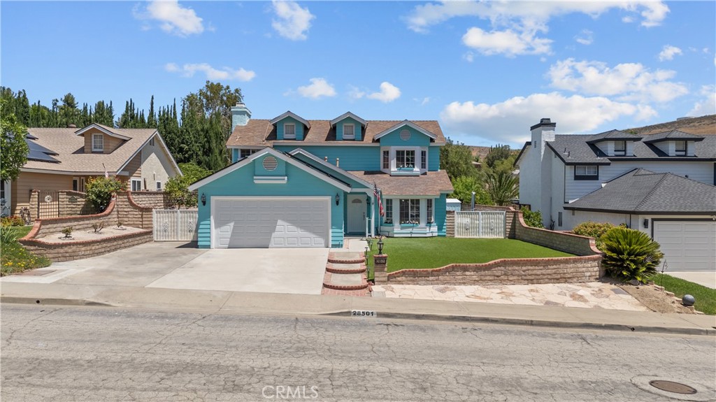 28501 Victoria Road Castaic, CA 91384 - Photo 1 of 45 a front view of a house with a yard and potted plants