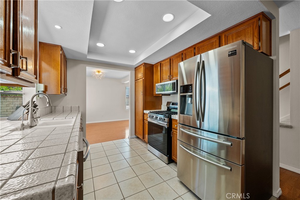 28501 Victoria Road Castaic, CA 91384 - Photo 13 of 45 a kitchen with stainless steel appliances granite countertop a refrigerator and a sink