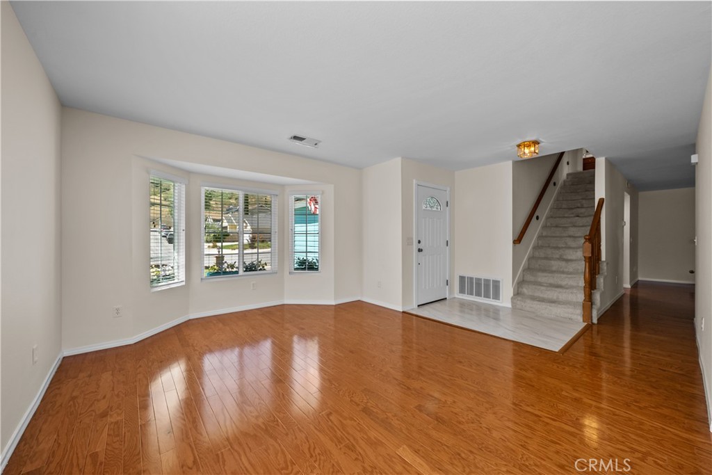 28501 Victoria Road Castaic, CA 91384 - Photo 4 of 45 wooden floor in an empty room with a window
