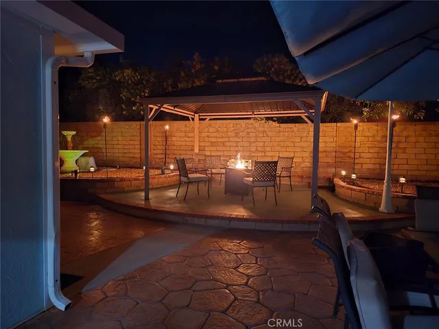 an aerial view of multiple houses with yard