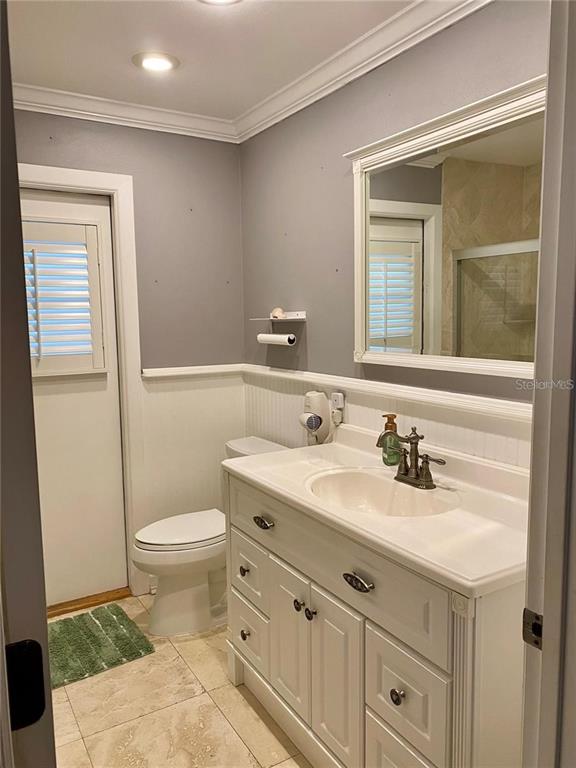 6310 Cocoa Lane Apollo Beach, FL 33572 - Photo 12 of 19 a bathroom with a sink a toilet and a mirror