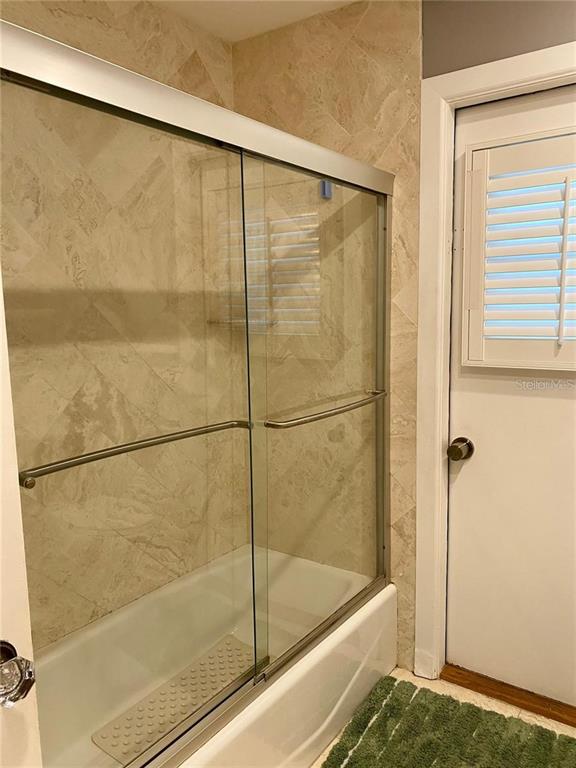 6310 Cocoa Lane Apollo Beach, FL 33572 - Photo 14 of 19 a bathroom with a bathtub and a shower