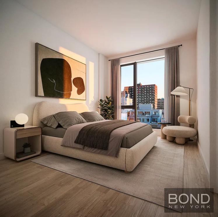 a bedroom with a bed and a couch