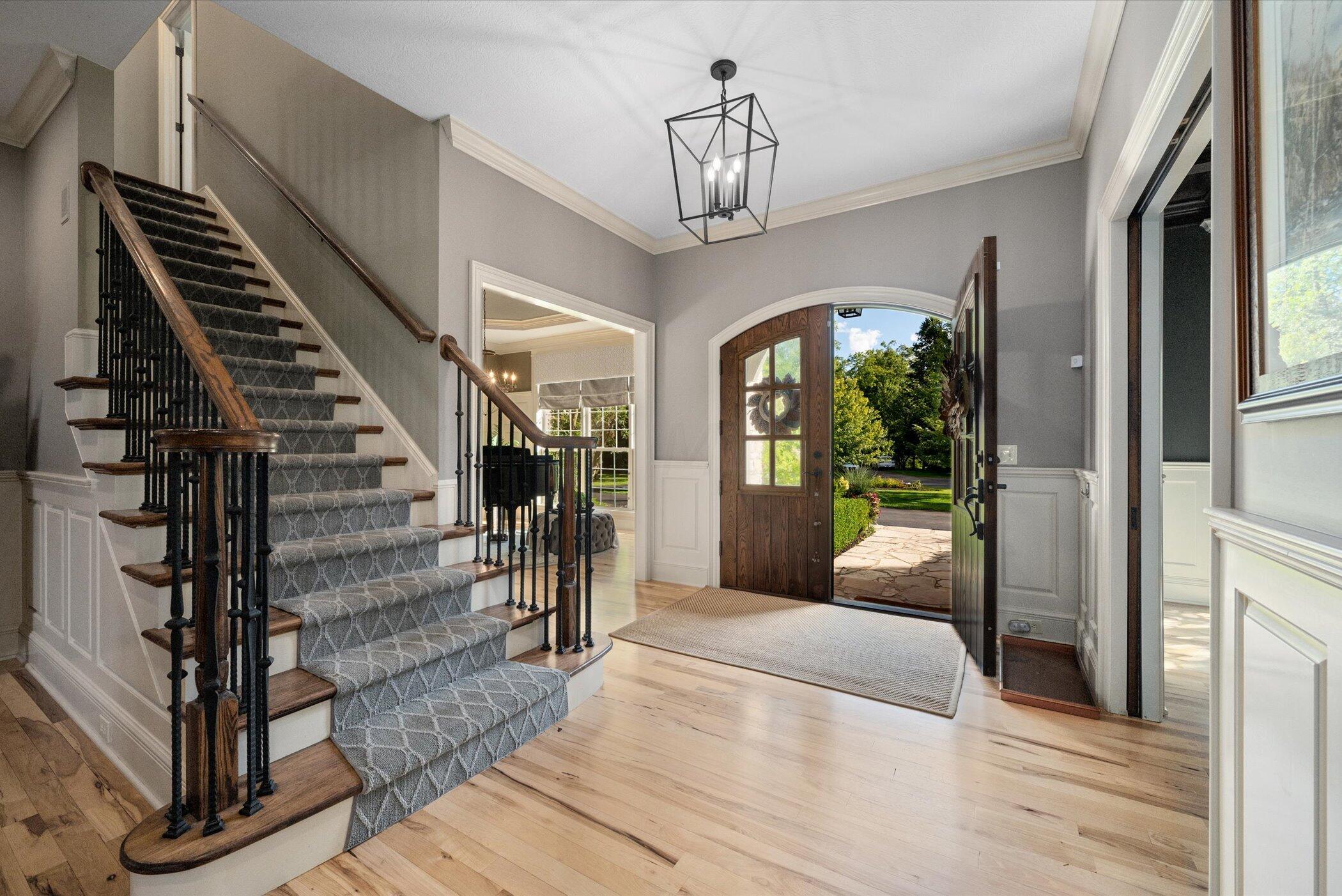 Solid Wood Arch Doors and Hickory Flooring Throughout