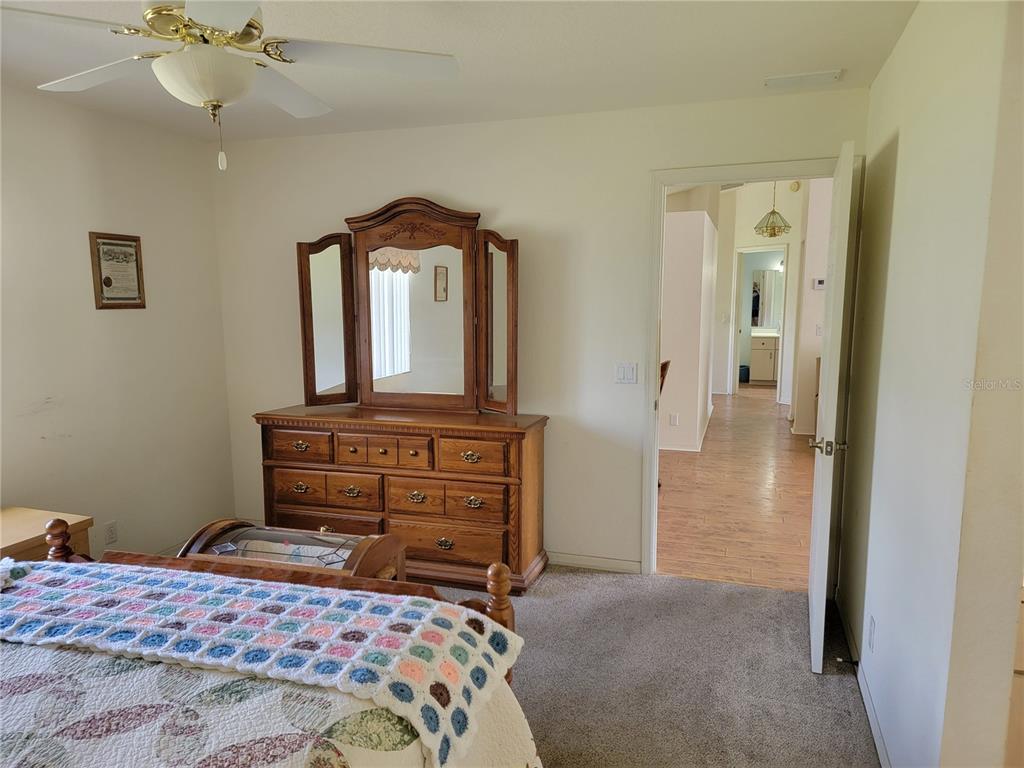 10269 Southwest 63rd Avenue Ocala, FL 34476 - Photo 25 of 48 a bedroom with a bed and a dresser