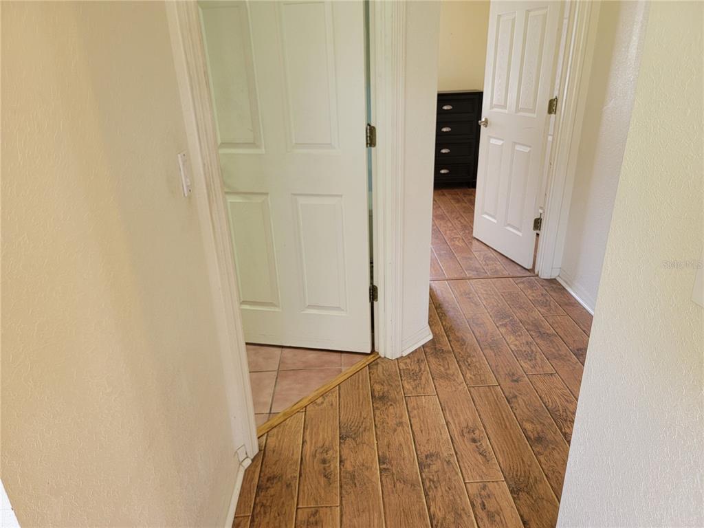 10269 Southwest 63rd Avenue Ocala, FL 34476 - Photo 39 of 48 a view of a hallway with wooden floor and staircase
