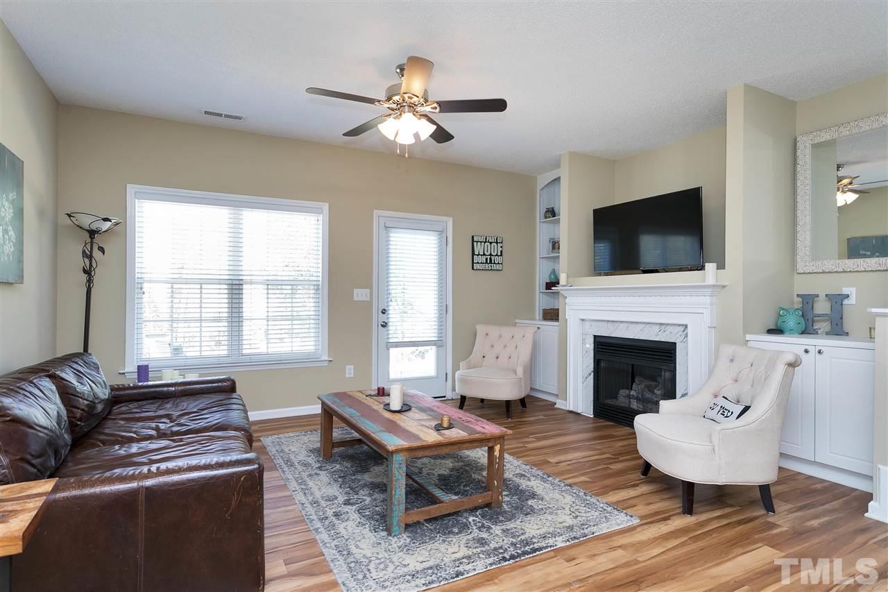 2049 Persimmon Ridge Drive Raleigh, NC 27604 - Photo 15 of 15 The open floor plan makes the home feel light, bright and airy, with tons of natural light flowing into the home. Notice the beautiful built-in bookcases, just one of many special touches in this wonderful home.