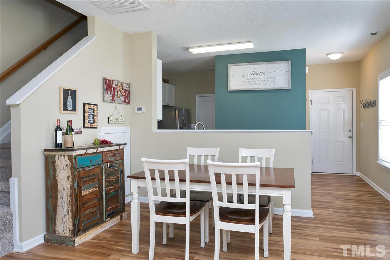 2049 Persimmon Ridge Drive Raleigh, NC 27604 - Photo 5 of 15 You'll enjoy dining on meals prepared in your wonderful kitchen. Notice how the dining area is open to the kitchen, providing a great flow for serving food and entertaining.