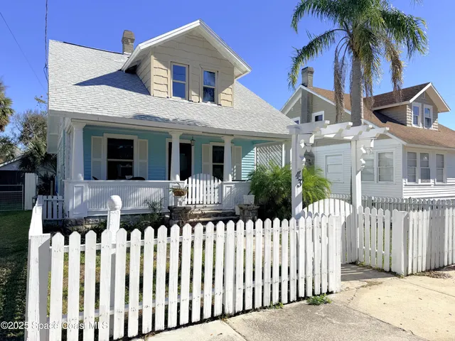 a front view of house with small garden