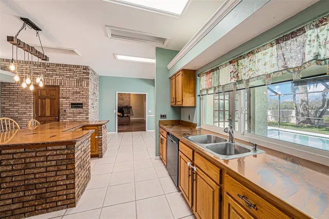 a kitchen with stainless steel appliances granite countertop a sink and cabinets