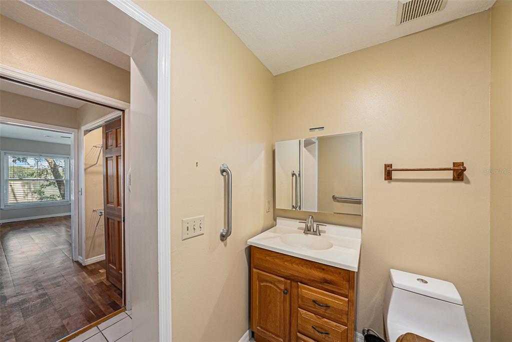 3018 Colonial Ridge Drive Brandon, FL 33511 - Photo 18 of 36 a bathroom with a sink a toilet and shower