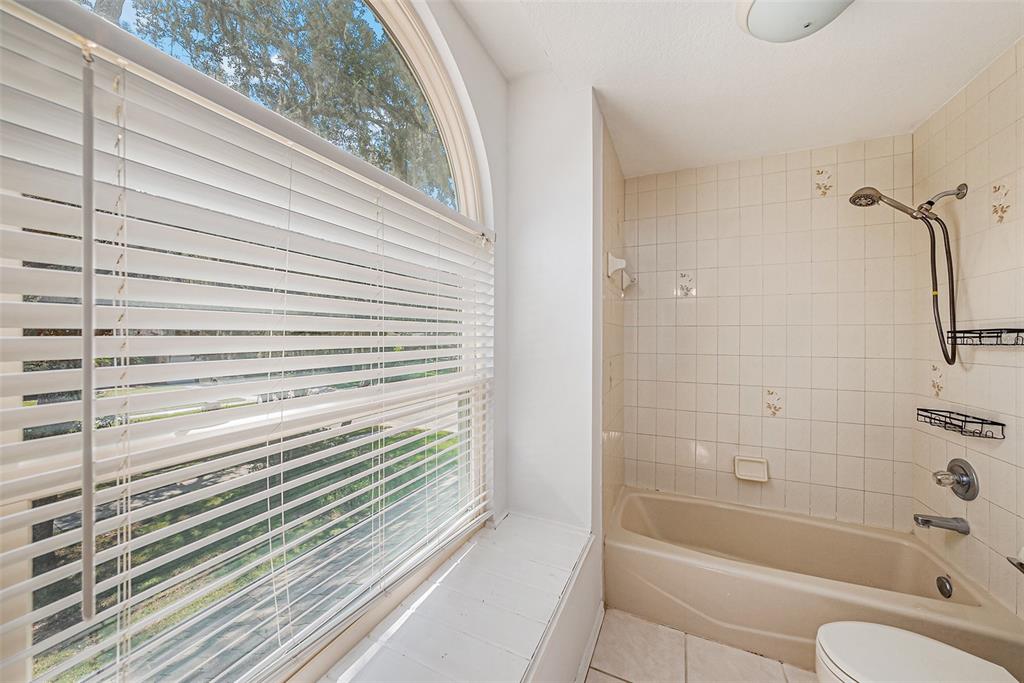 3018 Colonial Ridge Drive Brandon, FL 33511 - Photo 27 of 36 a bathroom with a bathtub and a shower