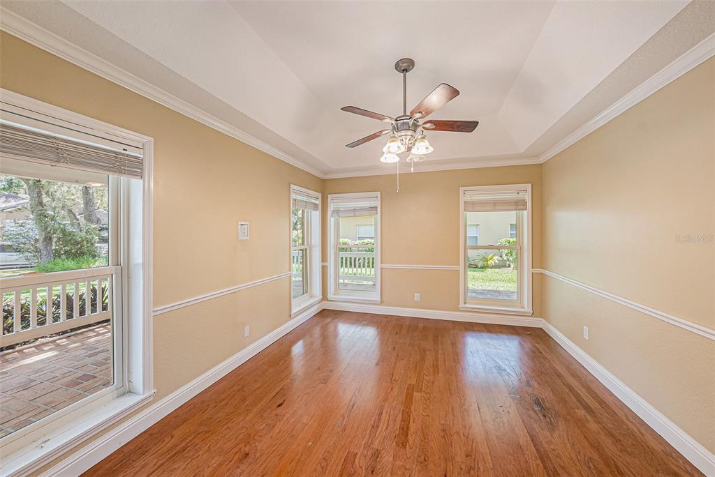3018 Colonial Ridge Drive Brandon, FL 33511 - Photo 4 of 36 wooden floor in an empty room with a window