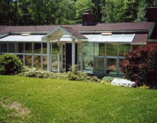 115 Roseville Road Westport, CT 06880 - Photo 1 of 1 a view of a house with garden and yard