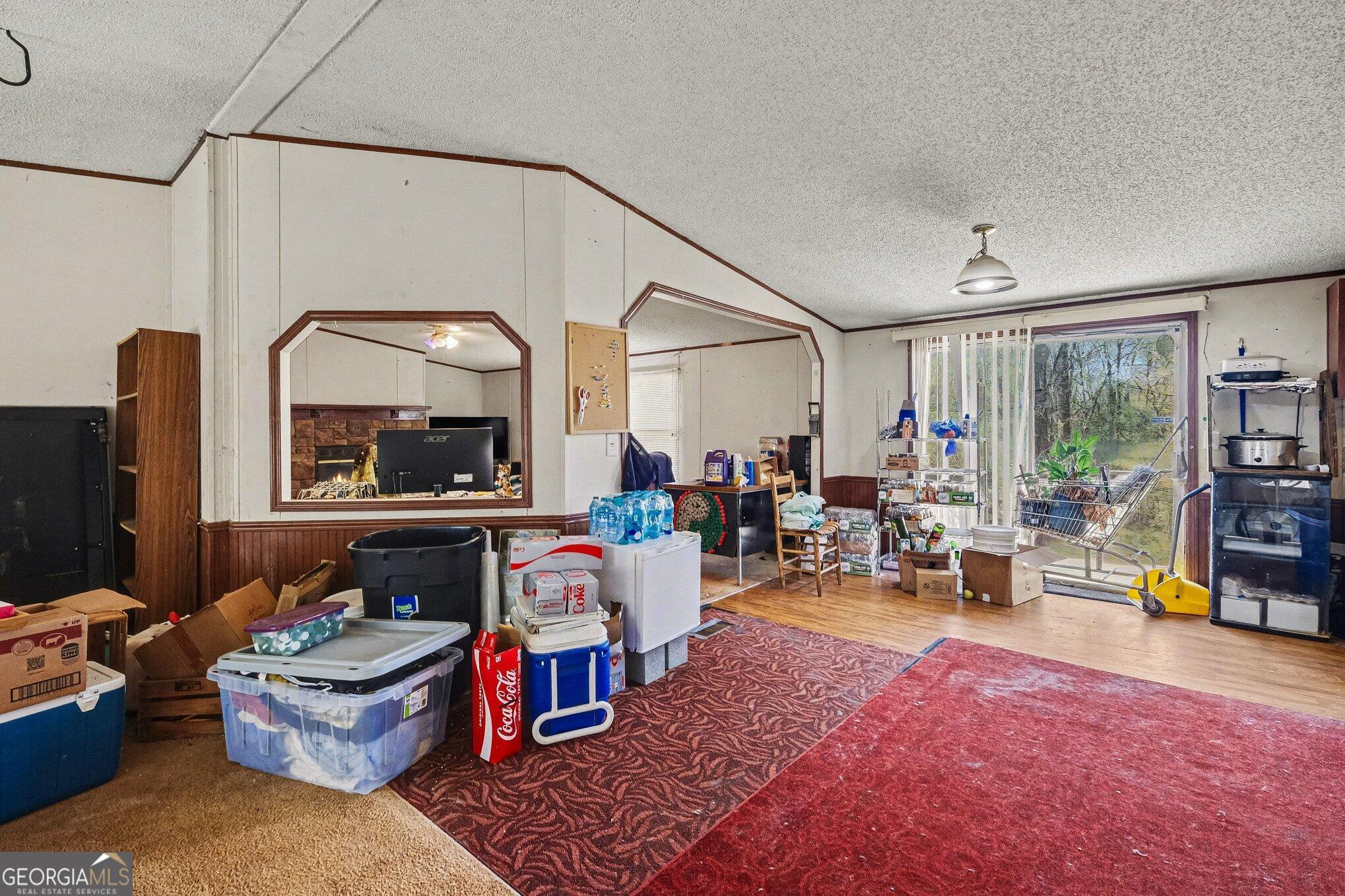 109 Mill Run Comer, GA 30629 - Photo 11 of 23 a living room with furniture and a fireplace